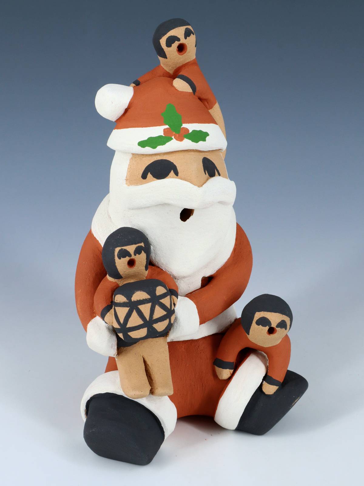 Jemez Pueblo Pottery Santa Claus Storyteller Figurine - PuebloDirect.com