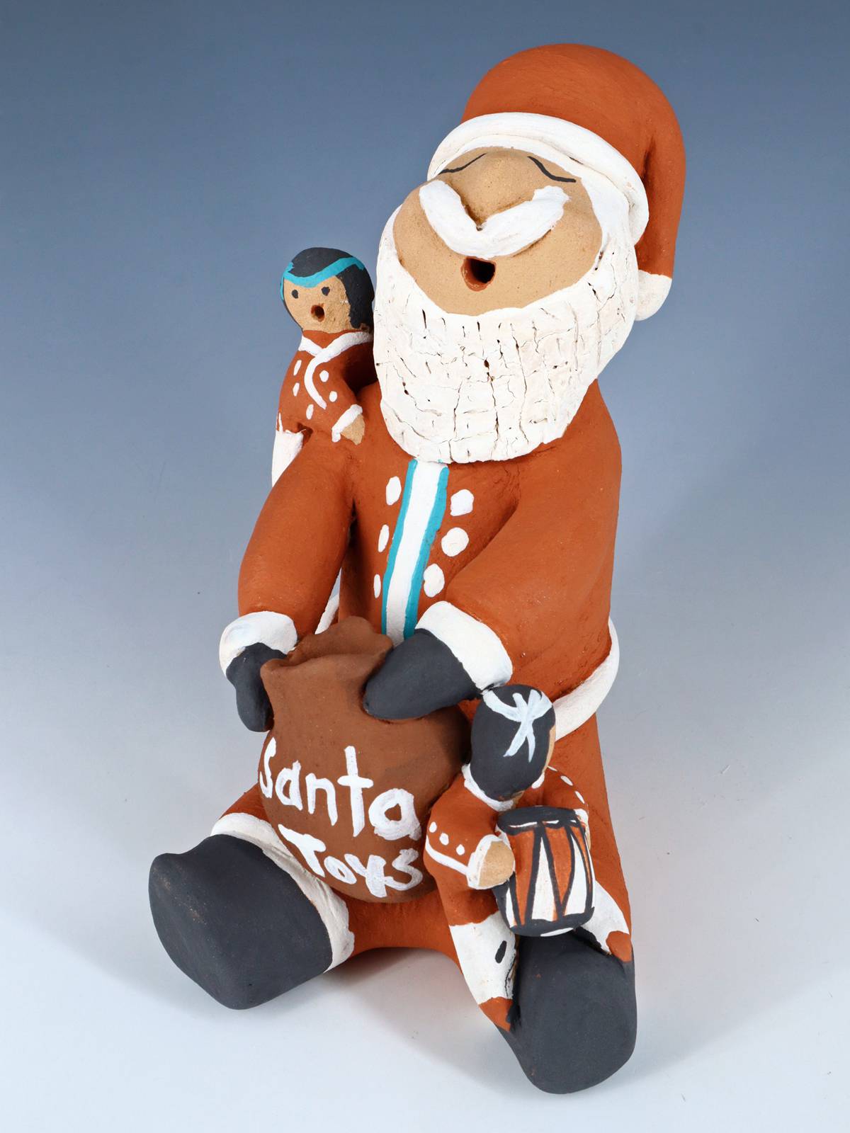 Jemez Pueblo Pottery Santa Claus Storyteller Doll - PuebloDirect.com
