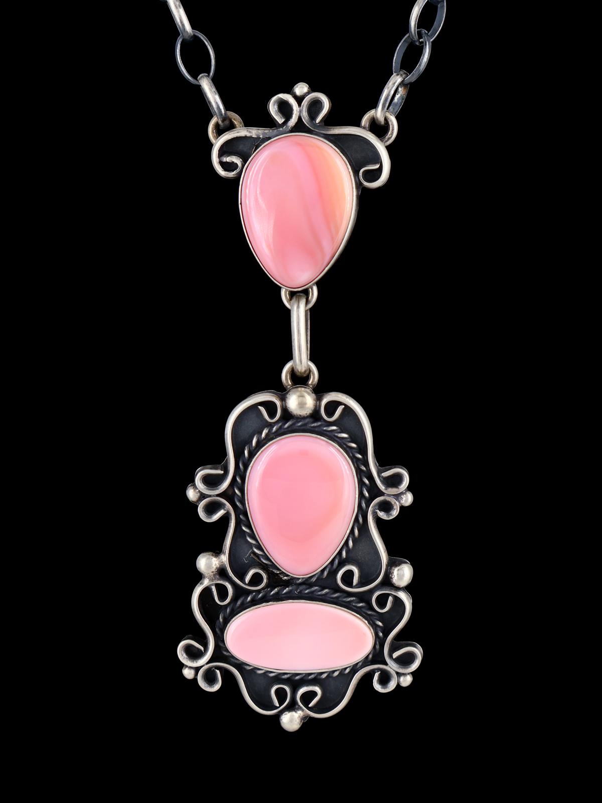 Juego de aretes y collar con forma de lazo de plata de ley con rodocrosita de nativos americanos