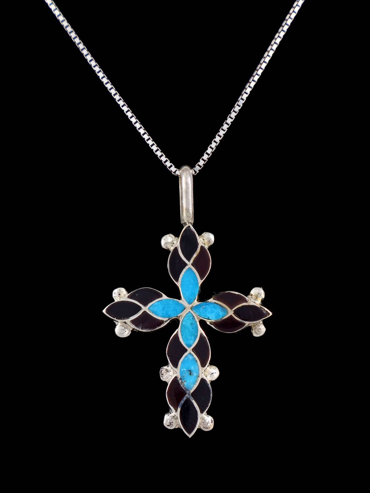 Colgante de cruz de ónix negro con incrustaciones Zuni de plata de ley