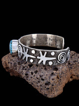 Navajo Sterling Silver Kingman Turquoise Petroglyph Cuff Bracelet - PuebloDirect.com