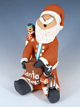Jemez Pueblo Pottery Santa Claus Storyteller Doll - PuebloDirect.com