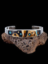 Pulsera Navajo de plata de ley con incrustaciones de cielo nocturno
