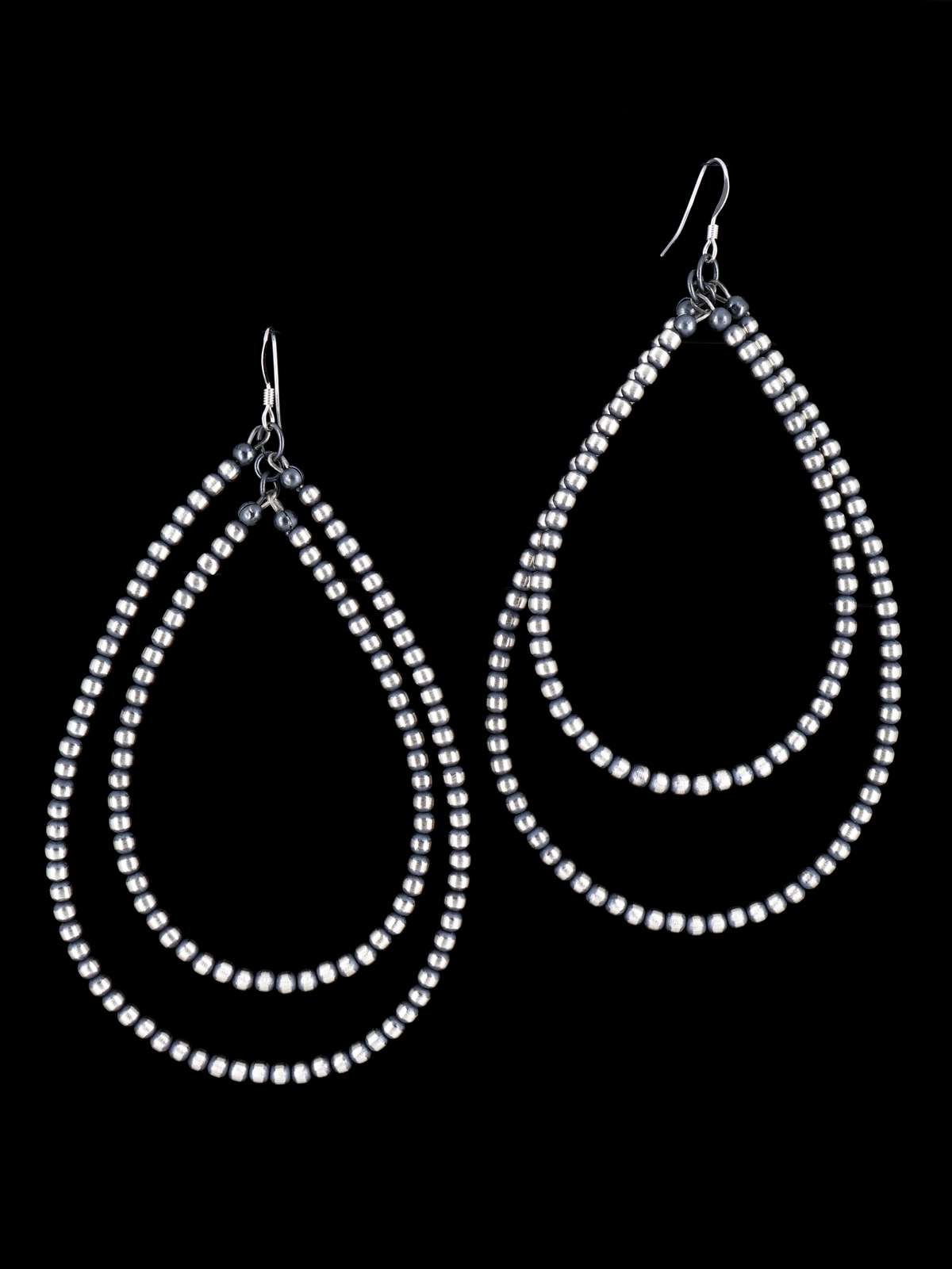 Pendientes colgantes de cuentas de plata de ley y caracola rosa navajo