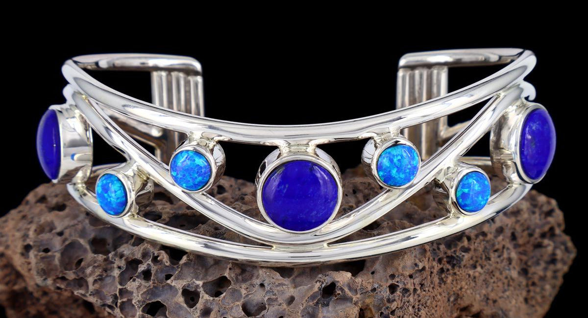Silver bracelet with blue stones on a dark background