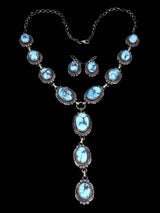 Juego de collar tipo lazo de plata de ley con turquesa de Golden Hill