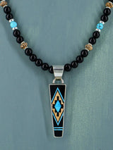 Collar con colgante de oso reversible con incrustaciones de búfalo blanco navajo