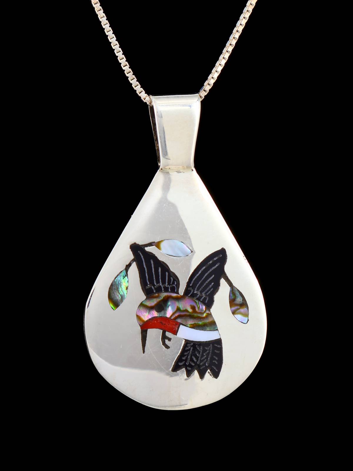 Pendentif oiseau incrusté de bijoux amérindiens