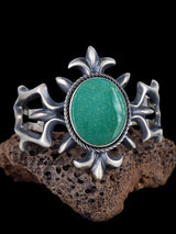 Pulsera de puño de hueso de dinosaurio con gema de plata de ley fundida de Tufa Navajo